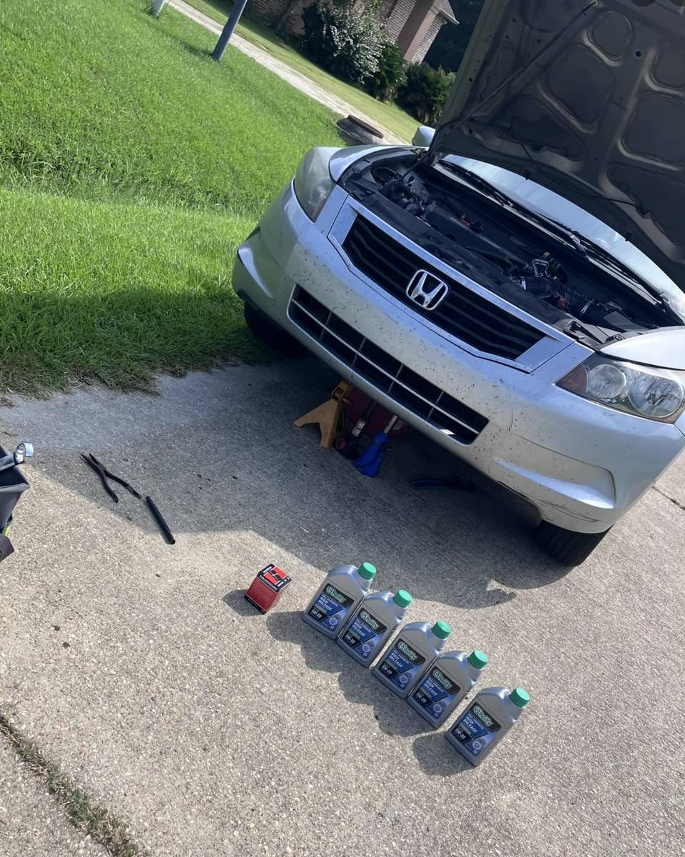 Oil change in a Denver driveway by a mobile mechanic