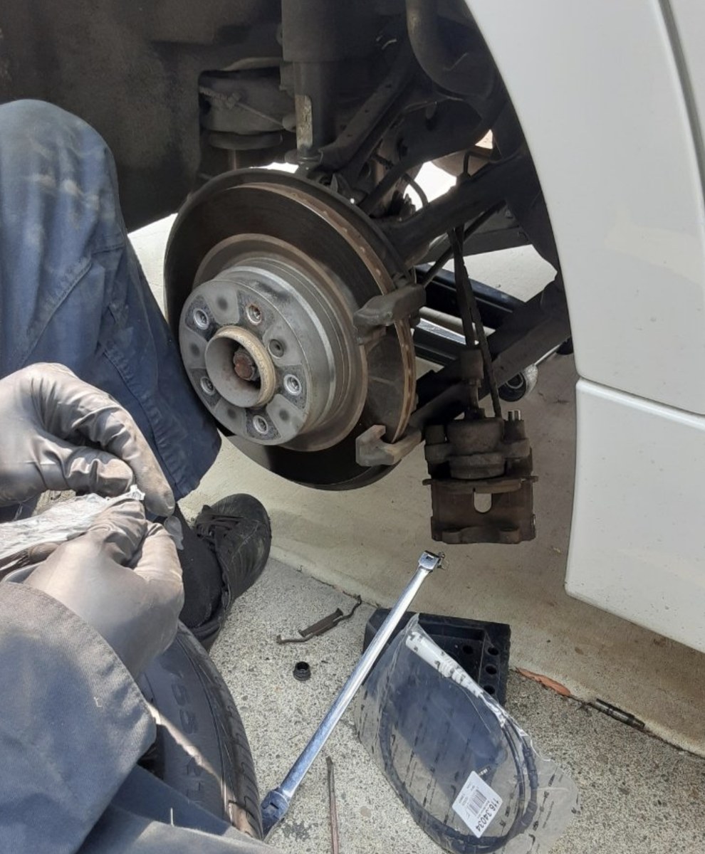 Brake repair by a mobile mechanic in Denver, rotor and caliper work