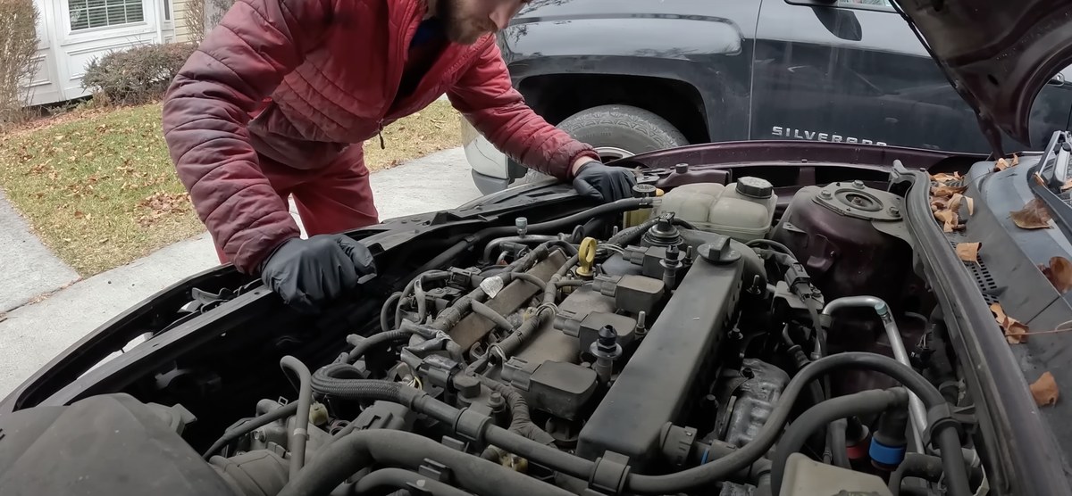 Denver mobile mechanic working on a car in a customer's driveway