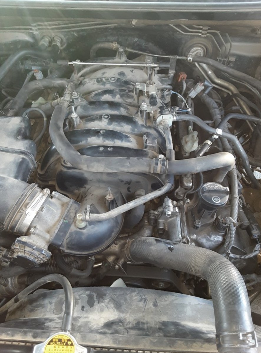 Denver mobile mechanic inspecting an engine during a diagnostic visit