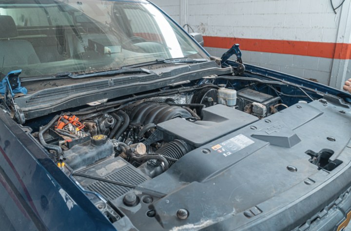 Denver mobile mechanic checking an engine bay during a no start call