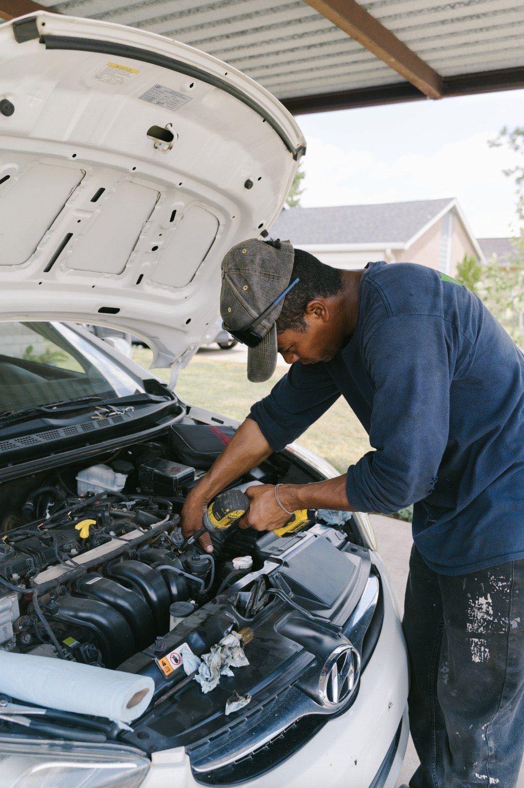 Mobile mechanic on a driveway job in Denver